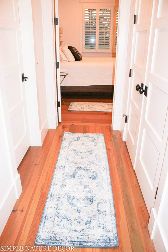 7 Ways to Refresh Your Home with Bright And Bold Home Decor Accents by adding a runner in hallway